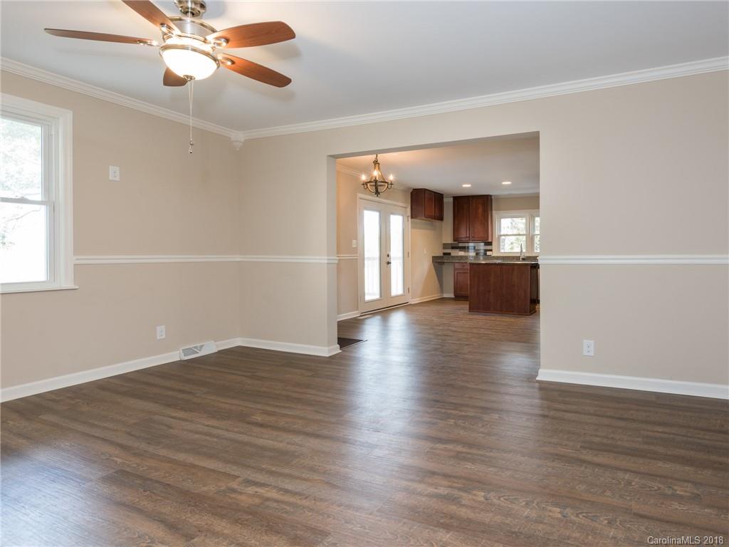 2022 Long Hope Road Monroe, NC 28112 - Photo 11 of 28 wooden floor in an empty room with a window