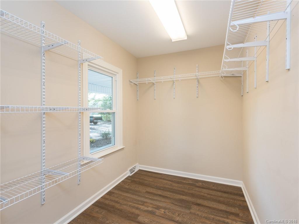 2022 Long Hope Road Monroe, NC 28112 - Photo 18 of 28 a view of an empty room with wooden floor and a window