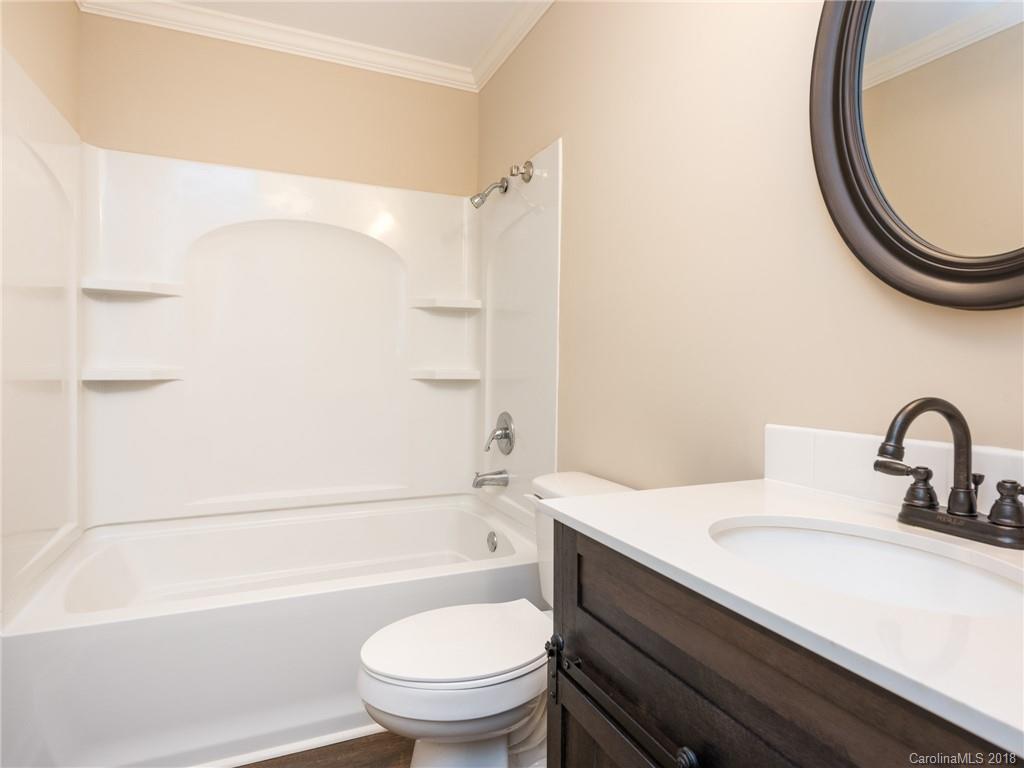 2022 Long Hope Road Monroe, NC 28112 - Photo 20 of 28 a bathroom with a sink a toilet and a bathtub