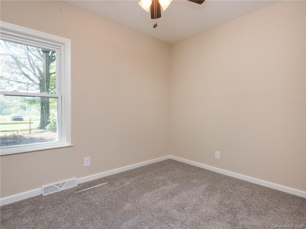 2022 Long Hope Road Monroe, NC 28112 - Photo 22 of 28 an empty room with a window