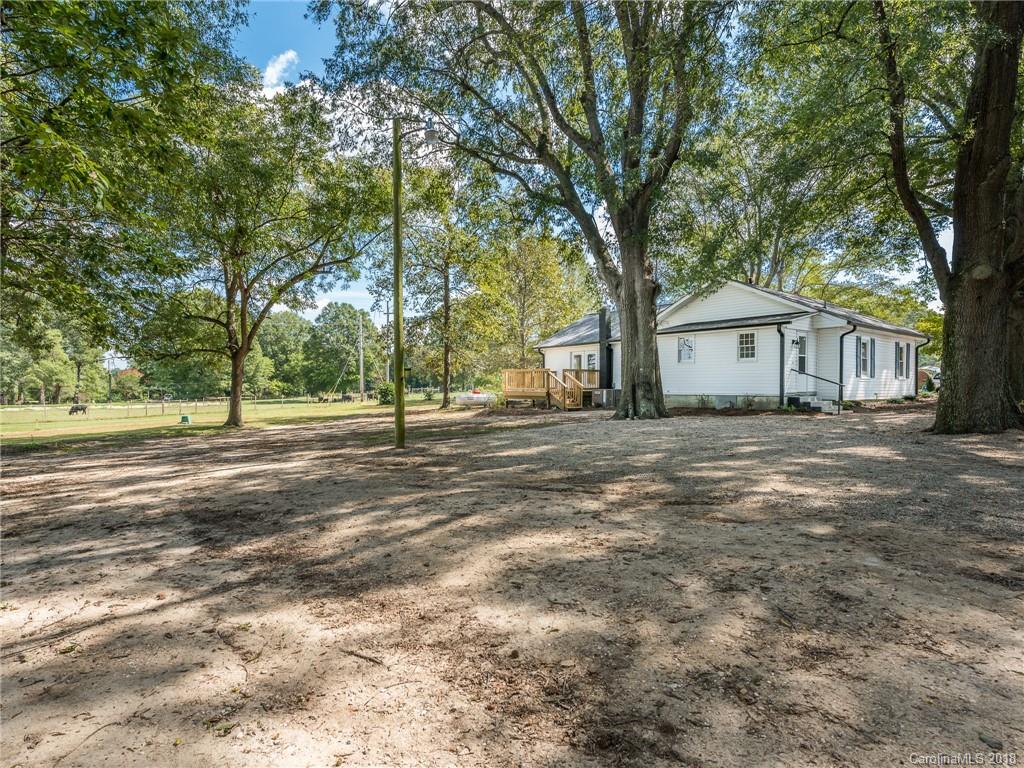 2022 Long Hope Road Monroe, NC 28112 - Photo 27 of 28 a view of large trees with a house