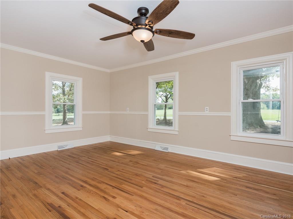 2022 Long Hope Road Monroe, NC 28112 - Photo 4 of 28 a view of empty room with wooden floor and fan