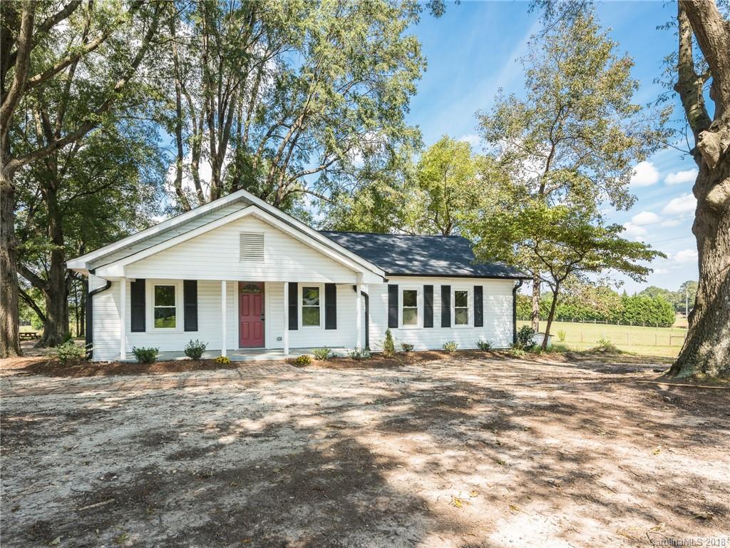 2022 Long Hope Road Monroe, NC 28112 - Photo 7 of 28 a front view of a house with a garden