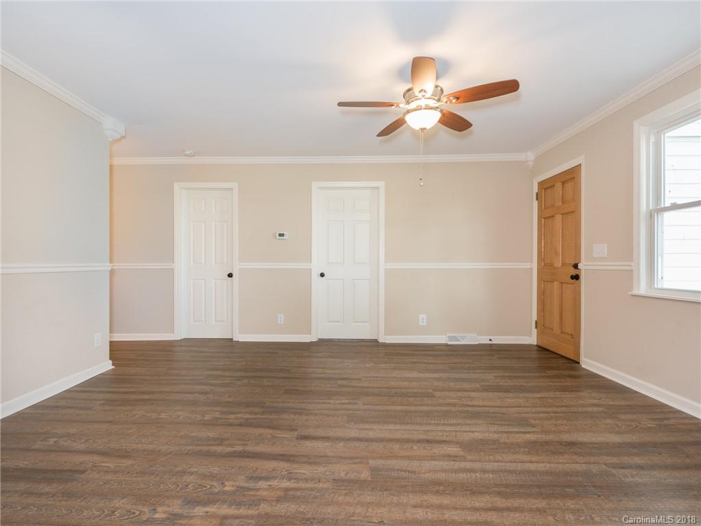 2022 Long Hope Road Monroe, NC 28112 - Photo 9 of 28 a view of an empty room with wooden floor and a window