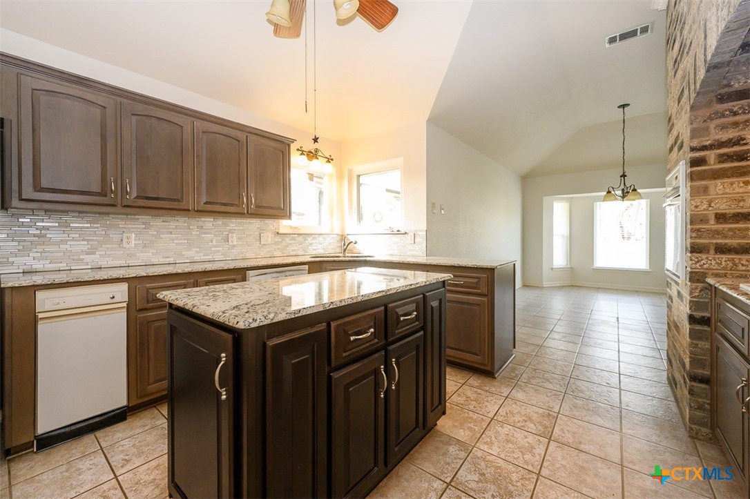 138 County Road 4963 Kempner, TX 76539 - Photo 11 of 46 a kitchen with a sink stove and cabinets