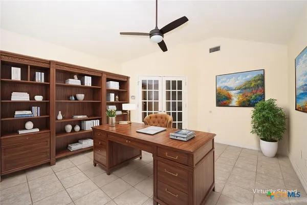 a view of a workspace with furniture