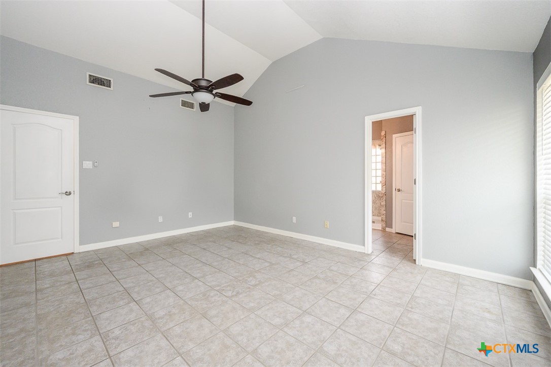 138 County Road 4963 Kempner, TX 76539 - Photo 22 of 46 an empty room with a ceiling fan and carpet