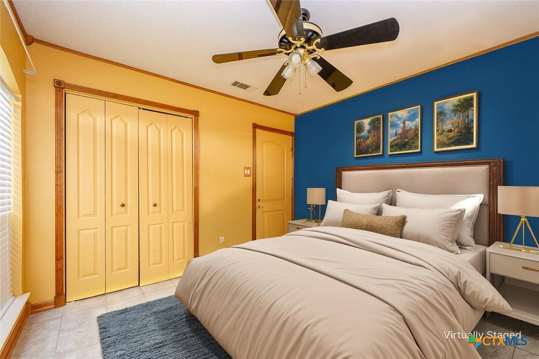 138 County Road 4963 Kempner, TX 76539 - Photo 26 of 46 a bedroom with a bed and a chandelier