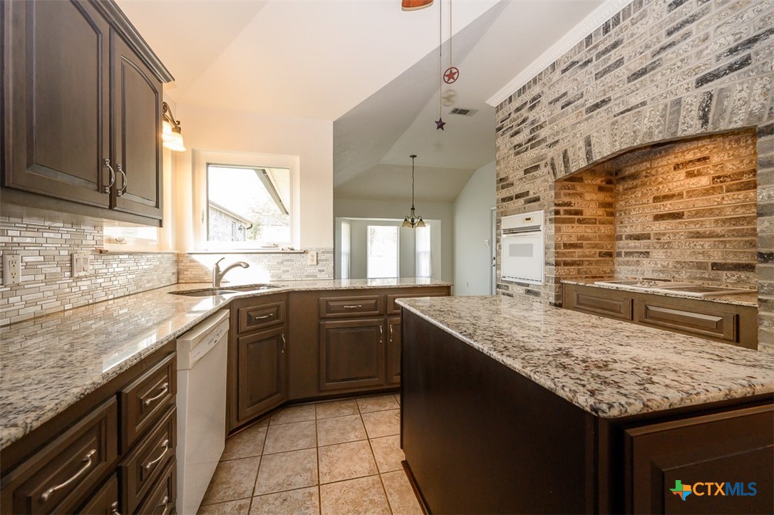 138 County Road 4963 Kempner, TX 76539 - Photo 7 of 46 a kitchen with a sink stove and cabinets