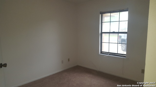 320 Station Street, Unit 101 Converse, TX 78109 - Photo 6 of 14 an empty room with a window