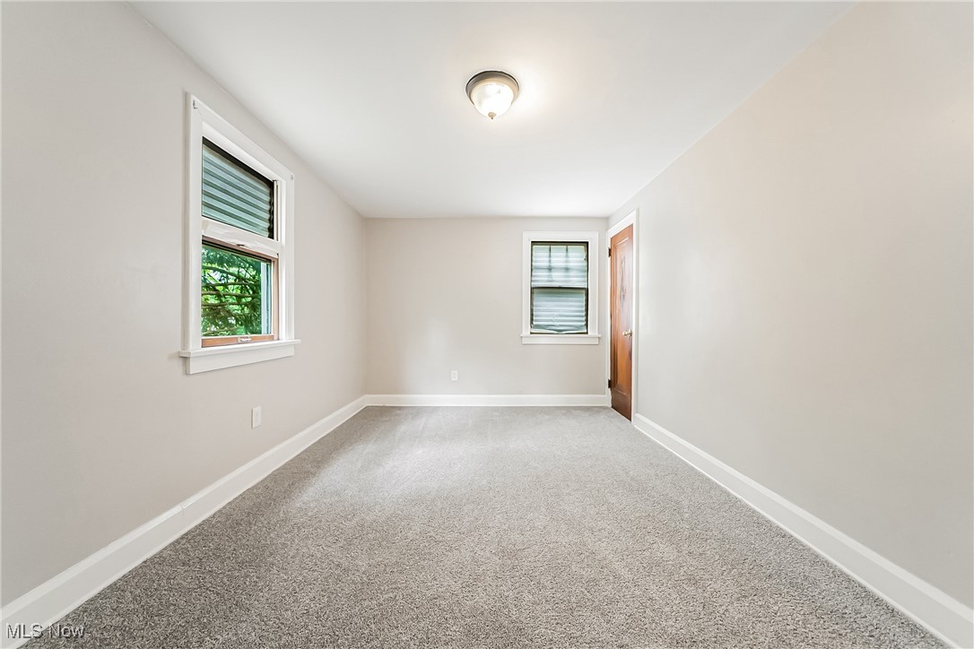 1271 Winston Road Cleveland, OH 44121 - Photo 30 of 43 Carpeted empty room featuring baseboards