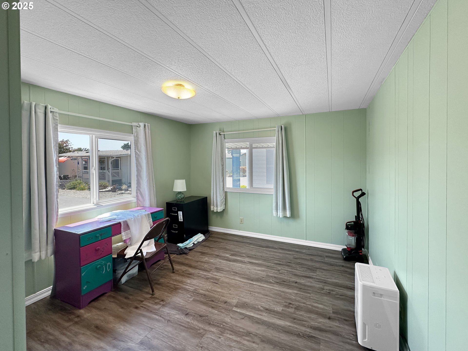 15889 Sunset Strip, Unit 35 Brookings, OR 97415 - Photo 13 of 21 a living room with furniture and a window