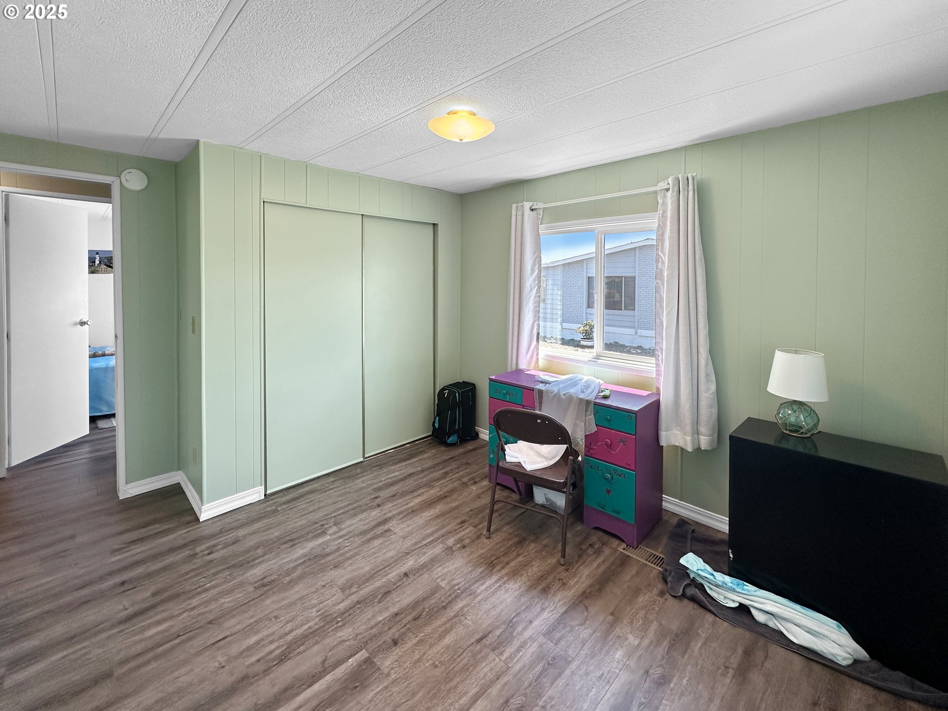 15889 Sunset Strip, Unit 35 Brookings, OR 97415 - Photo 14 of 21 a workspace with furniture hardwood and a window