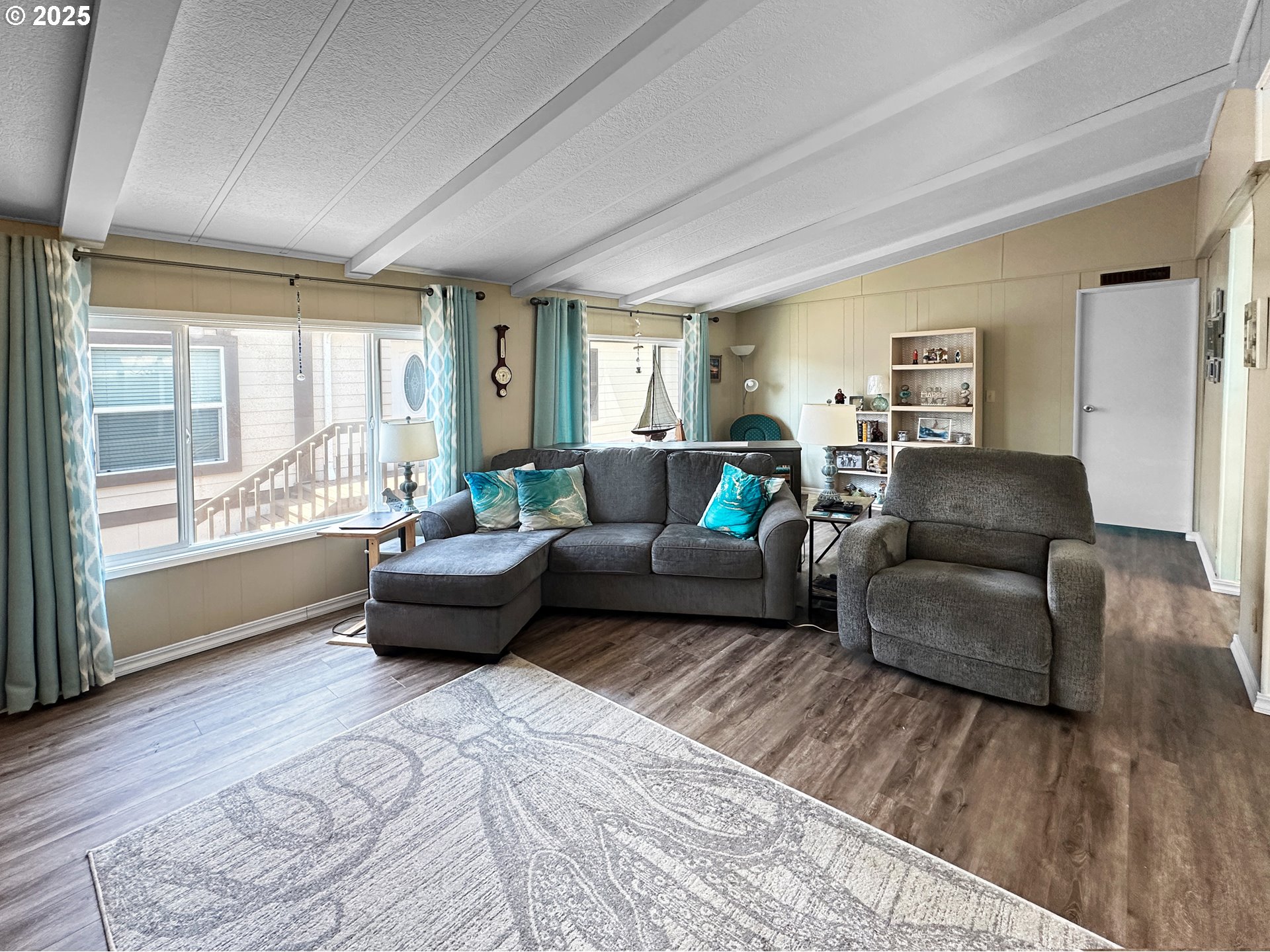 15889 Sunset Strip, Unit 35 Brookings, OR 97415 - Photo 5 of 21 a living room with furniture and a large window
