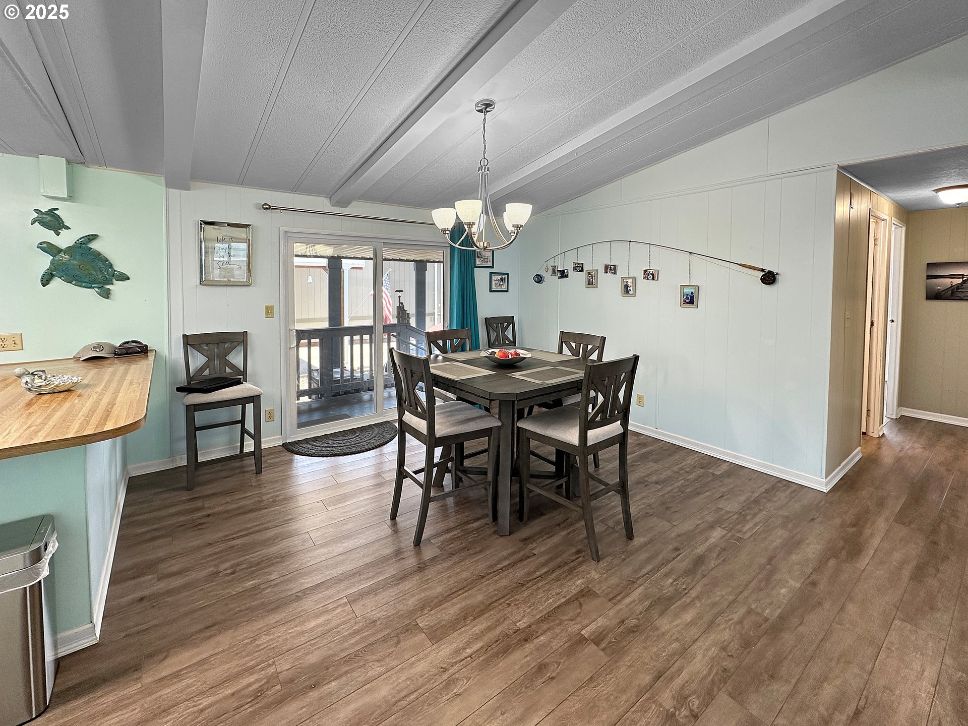 15889 Sunset Strip, Unit 35 Brookings, OR 97415 - Photo 6 of 21 a view of a dining room with furniture window and wooden floor