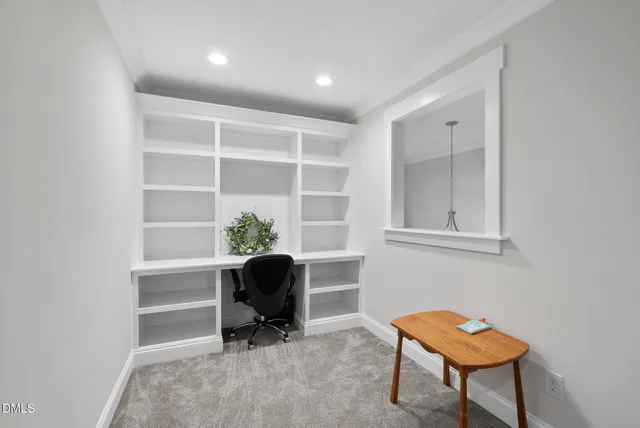 a workspace with furniture and a window