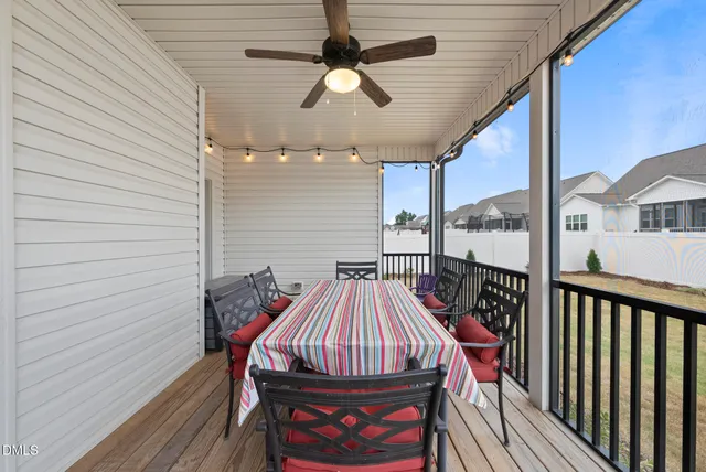 a view of a balcony with furniture