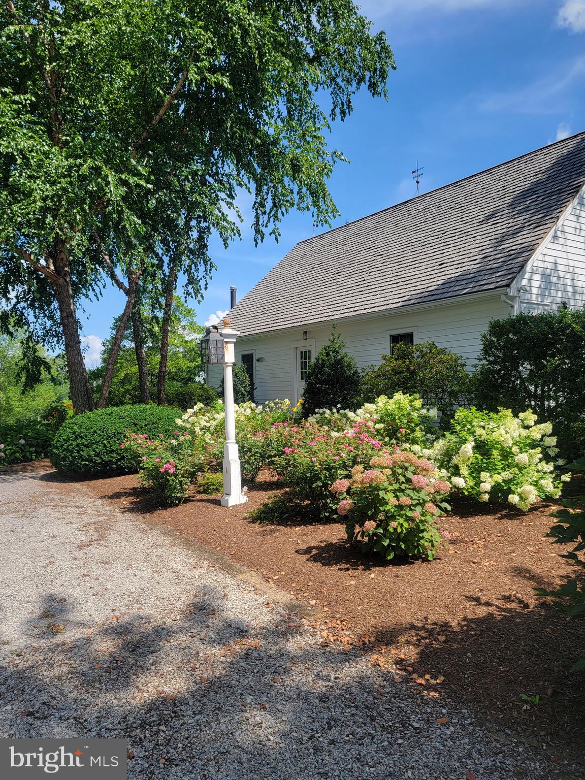 33 Rittenhouse Road, Unit E Stockton, NJ 08559 - Photo 15 of 15 a front view of a house with a yard