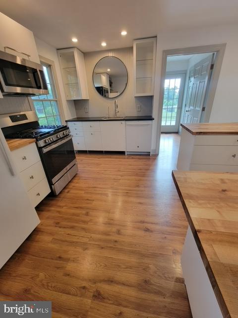 33 Rittenhouse Road, Unit E Stockton, NJ 08559 - Photo 4 of 15 a large kitchen with stainless steel appliances kitchen island granite countertop a stove a sink and a microwave