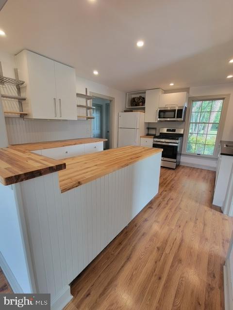 33 Rittenhouse Road, Unit E Stockton, NJ 08559 - Photo 5 of 15 a large kitchen with stainless steel appliances a large counter top a stove and a refrigerator