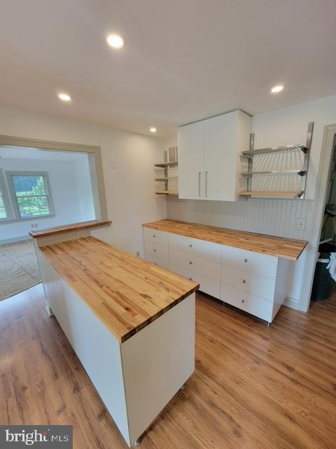 33 Rittenhouse Road, Unit E Stockton, NJ 08559 - Photo 6 of 15 a room with wooden floor and cabinets