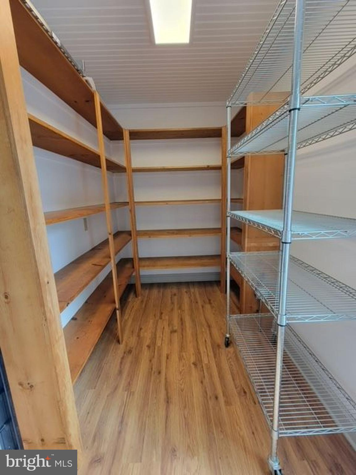 33 Rittenhouse Road, Unit E Stockton, NJ 08559 - Photo 7 of 15 a view of walk in closet with empty racks