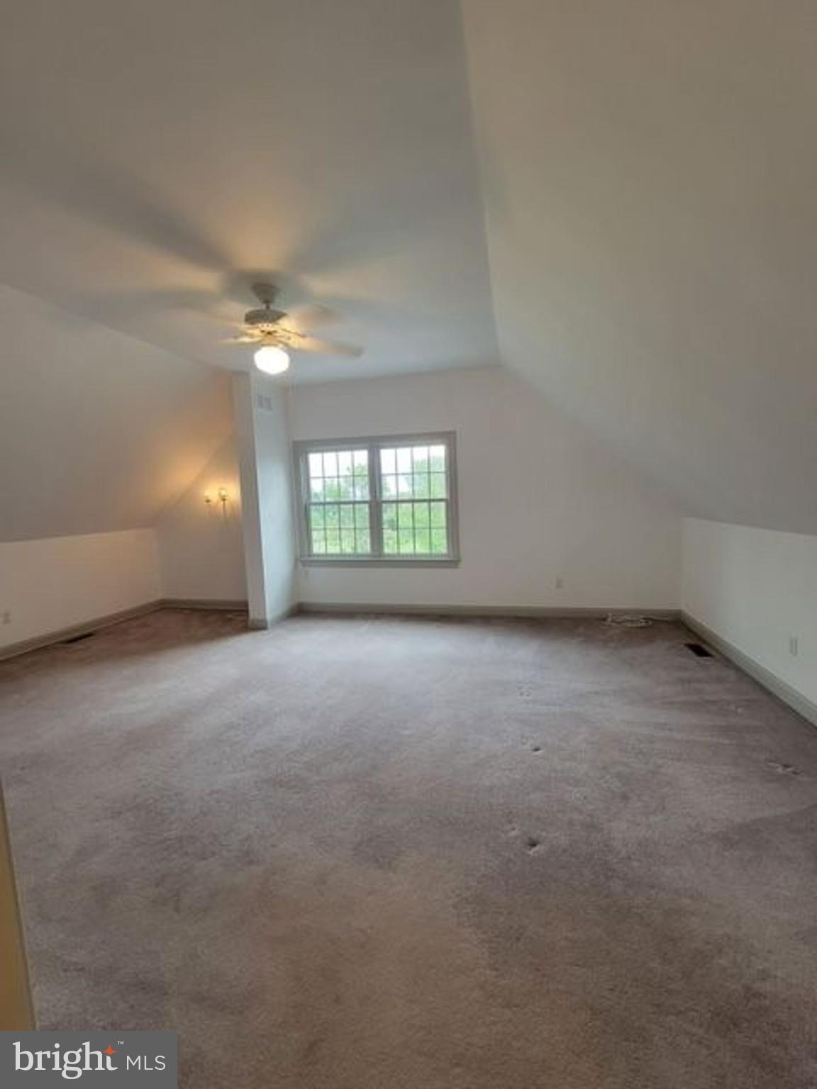 33 Rittenhouse Road, Unit E Stockton, NJ 08559 - Photo 9 of 15 an empty room with windows and fan