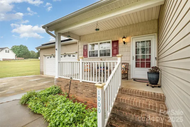 a view of a house with wooden floor and a yard