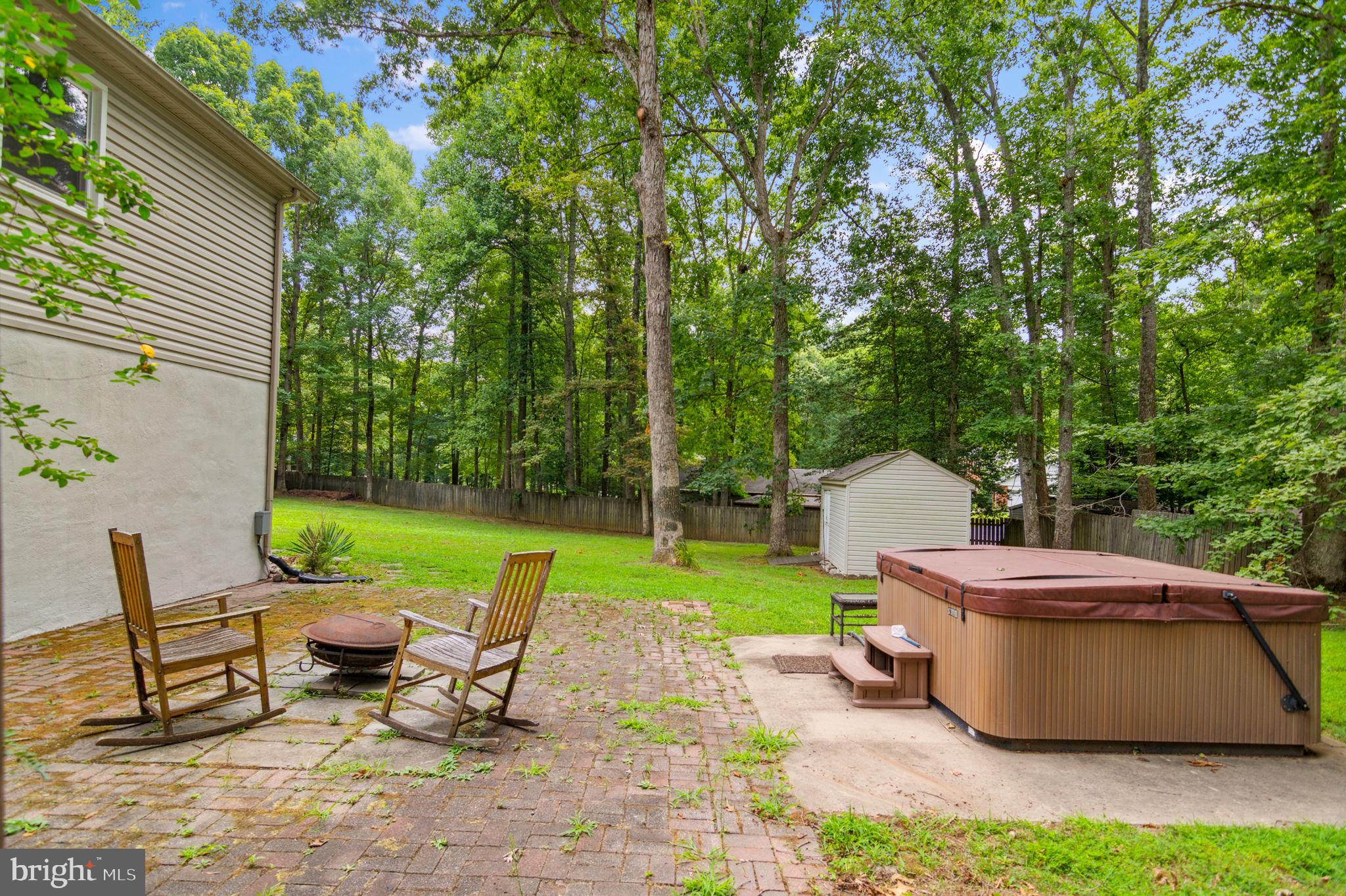 2567 Garrisonville Road Stafford, VA 22556 - Photo 35 of 56 Hot tub and fire pit