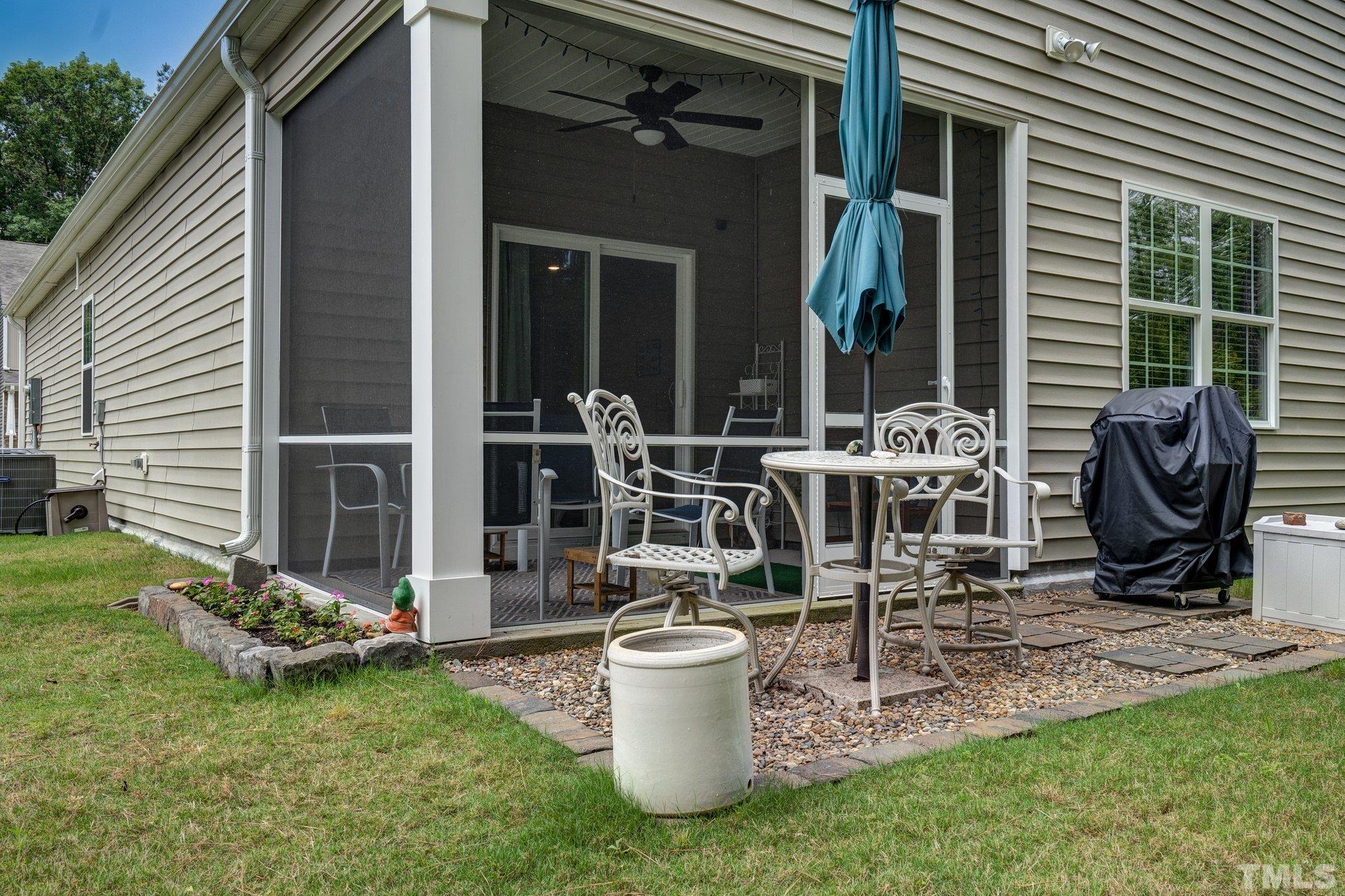 369 Lothian Rocky Mount, NC 27804 - Photo 28 of 32 a view of a patio with table and chairs and potted plants