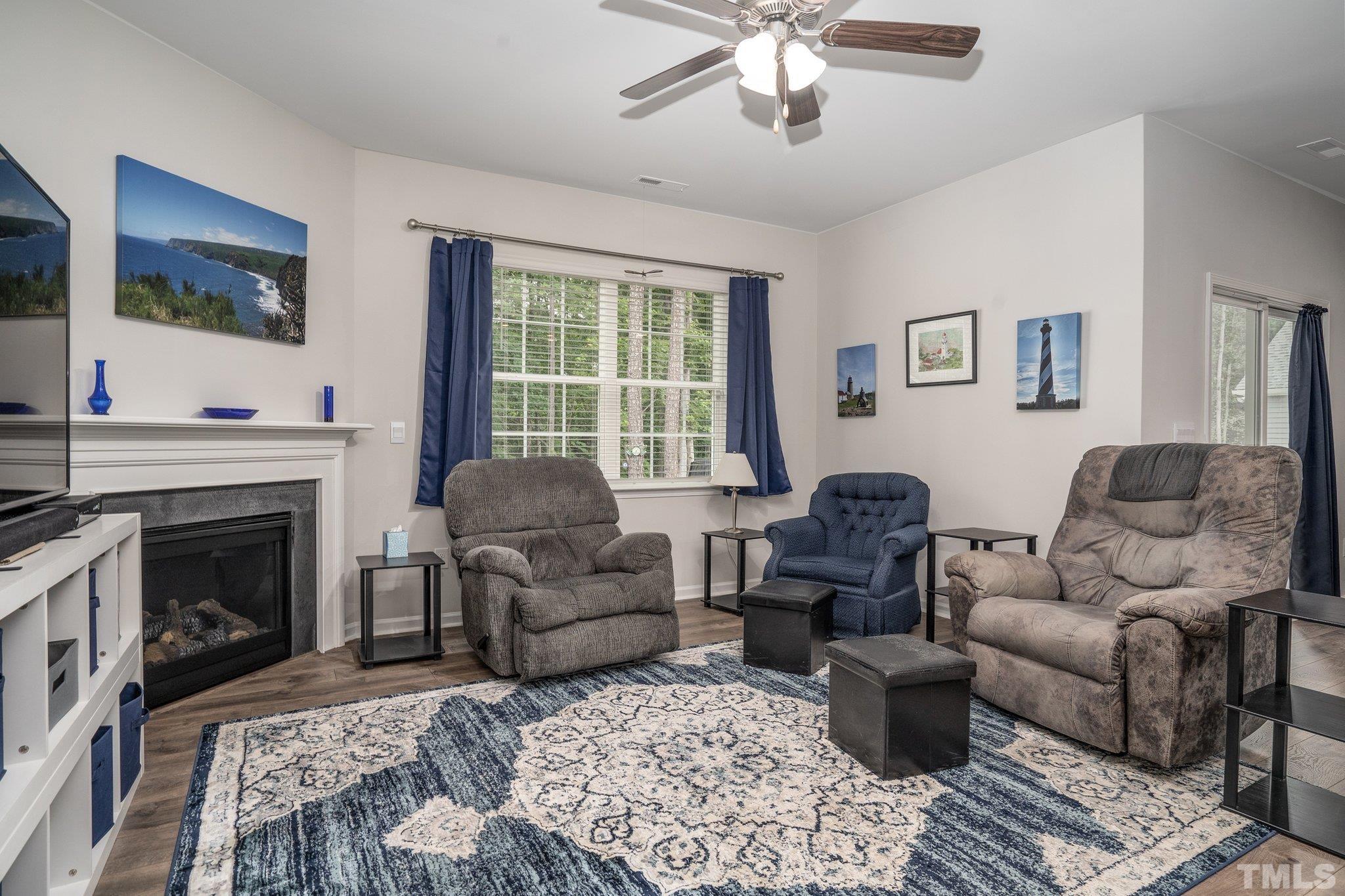 369 Lothian Rocky Mount, NC 27804 - Photo 4 of 32 a living room with furniture and a fireplace