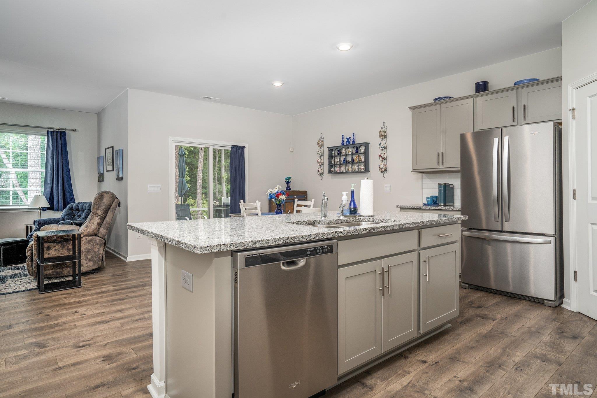 369 Lothian Rocky Mount, NC 27804 - Photo 9 of 32 a kitchen with stainless steel appliances granite countertop a sink stove and refrigerator