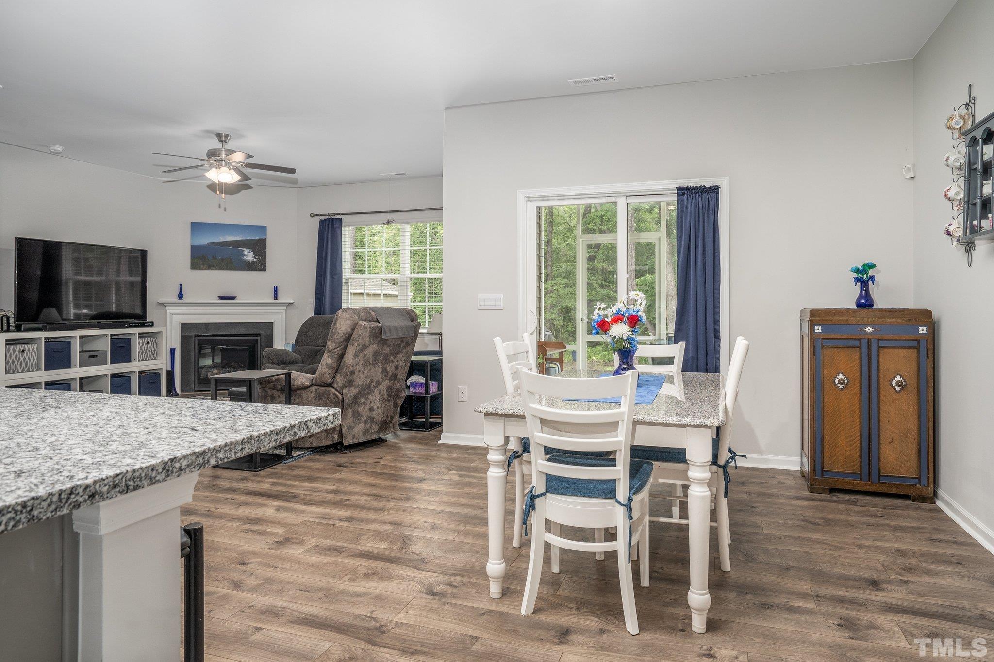 369 Lothian Rocky Mount, NC 27804 - Photo 10 of 32 a view of a dining room with furniture window and wooden floor