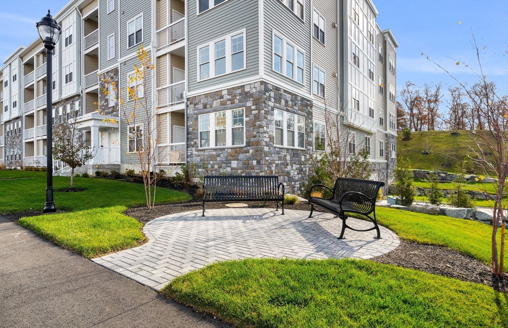 6 Stratton Drive, Unit 303 Woburn, MA 01801 - Photo 32 of 33 a building with garden in front of it