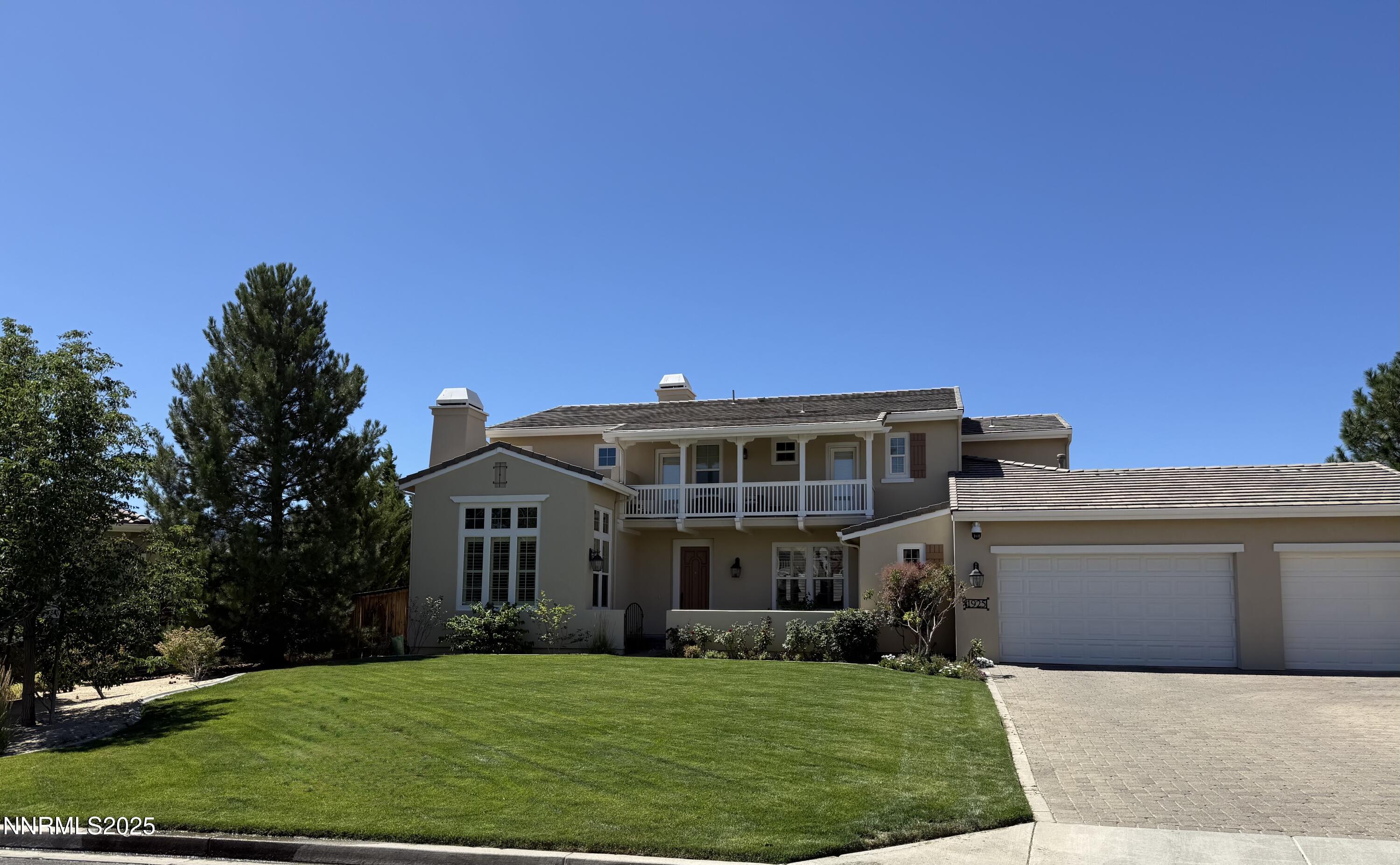 1925 Bechtol Ridge Circle Reno, NV 89523 - Photo 2 of 4 a view of a house with a yard and potted plants