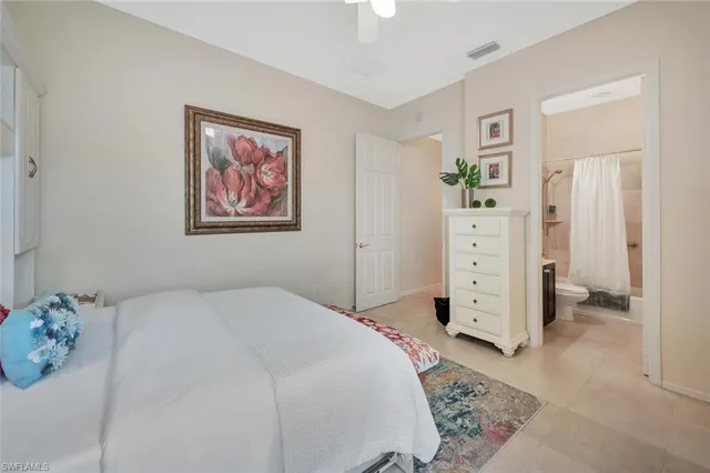 a bedroom with a bed and a cabinets