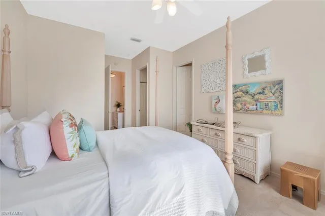 a bedroom with a bed and a cabinets