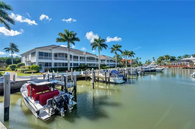 a view of a swimming pool with outdoor seating