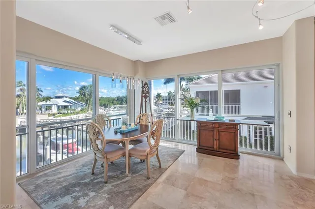 a dining room with furniture window wooden floor