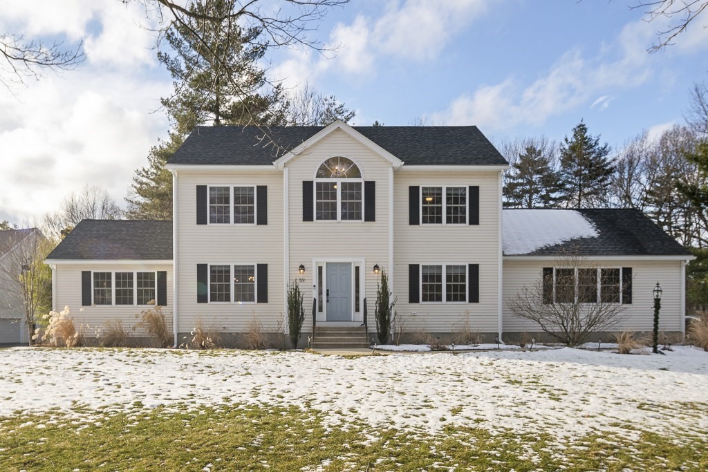 59 Grist Mill Road Littleton, MA 01460 - Photo 1 of 1 a front view of a house with a yard covered in snow