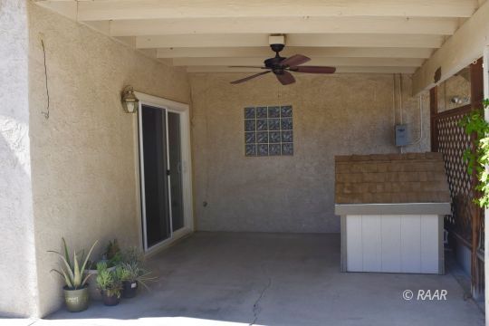 516 South Sorrel Street Ridgecrest, CA 93555 - Photo 25 of 32 a view of a hallway with a potted plant