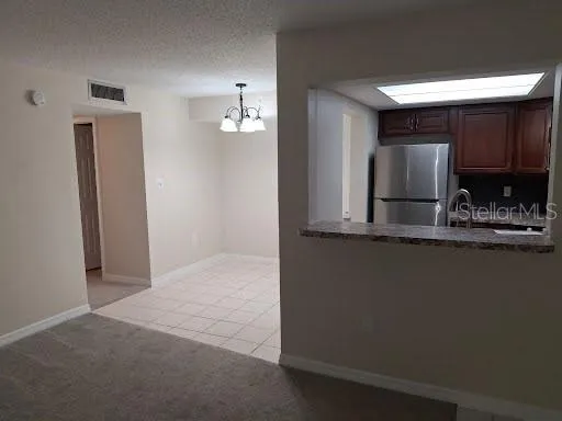 a view of kitchen and kitchen with furniture