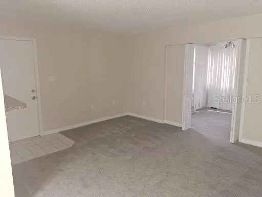 a view of an empty room and window