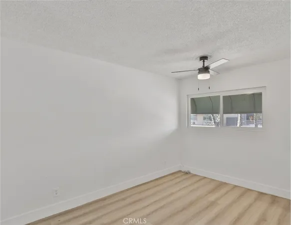 a white stove top oven sitting inside of a kitchen