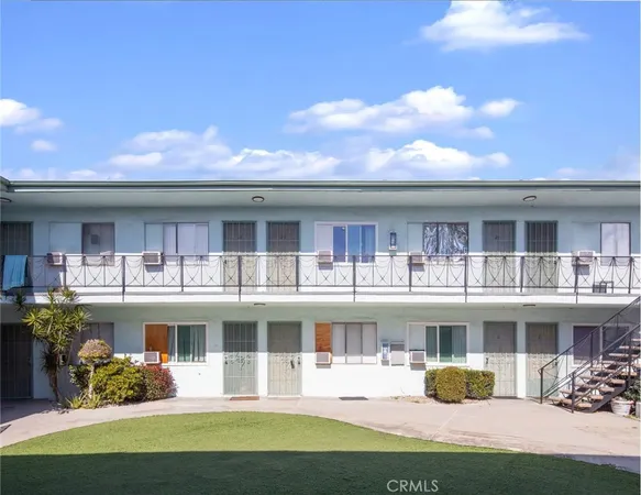 a view of a house with roof deck and sitting area