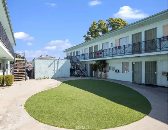 a view of a house with backyard porch and sitting area