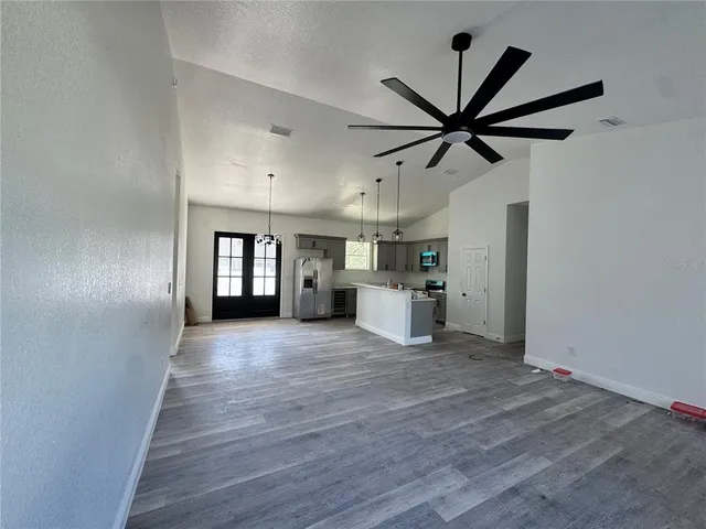 a view of a kitchen with a sink and a window