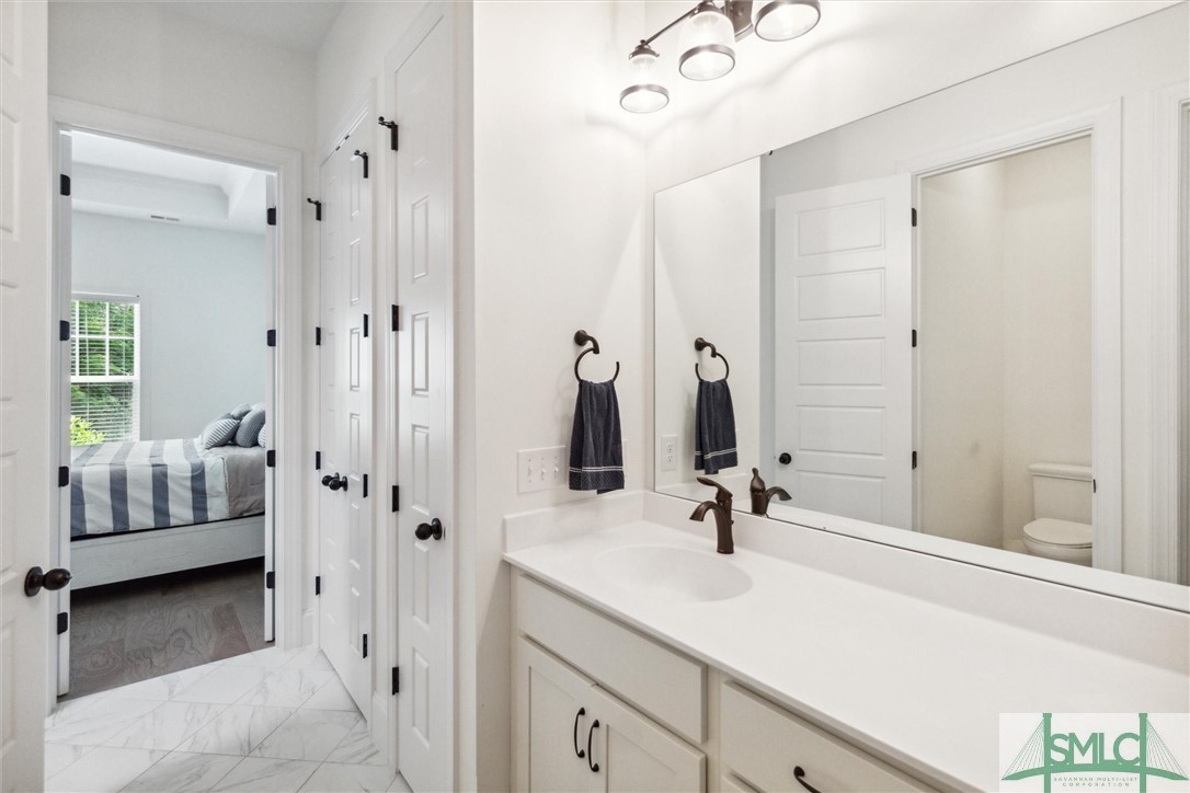 12 Golf Drive Pooler, GA 31322 - Photo 27 of 50 The primary bath has a second closet, a linen clos