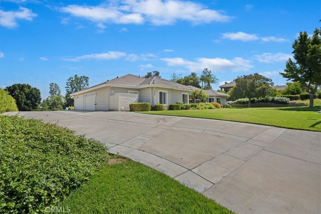 1507 Weston Way Riverside, CA 92506 - Photo 3 of 55 a front view of a house with a yard and trees