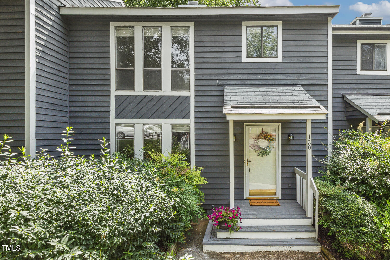 120 Joanne Circle Cary, NC 27513 - Photo 1 of 34 a front view of a house with a yard